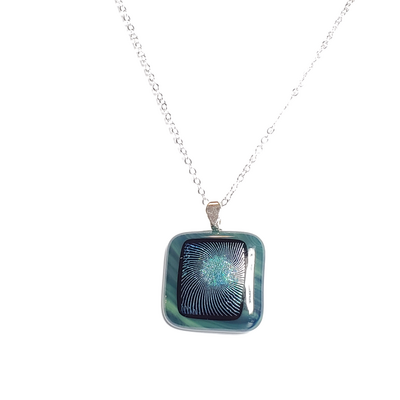 Dichroic geometric swirl on green fused glass pendant necklace