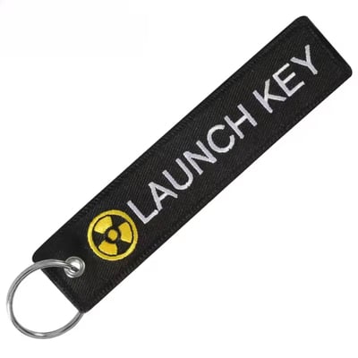 Remove before flight keychain