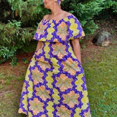 Sunset bloom off the shoulder cape dress