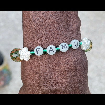 Famu nights🧡💚 glow in the dark alphabet bracelet🐍🐍🧡💚 ready-made🎨⏳️ by nubian collection artwear 👑 