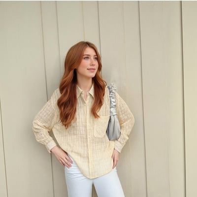 Workwear style mid-length top with a slightly transparent loose casual shirt